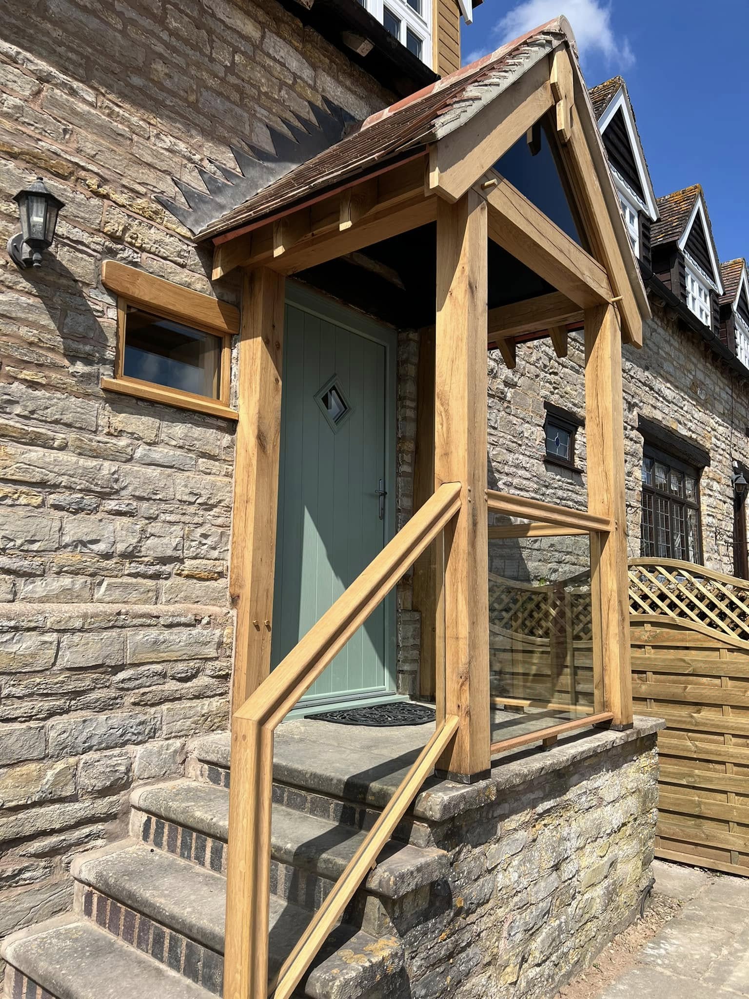 Classic timber beam extension with glass balustrades