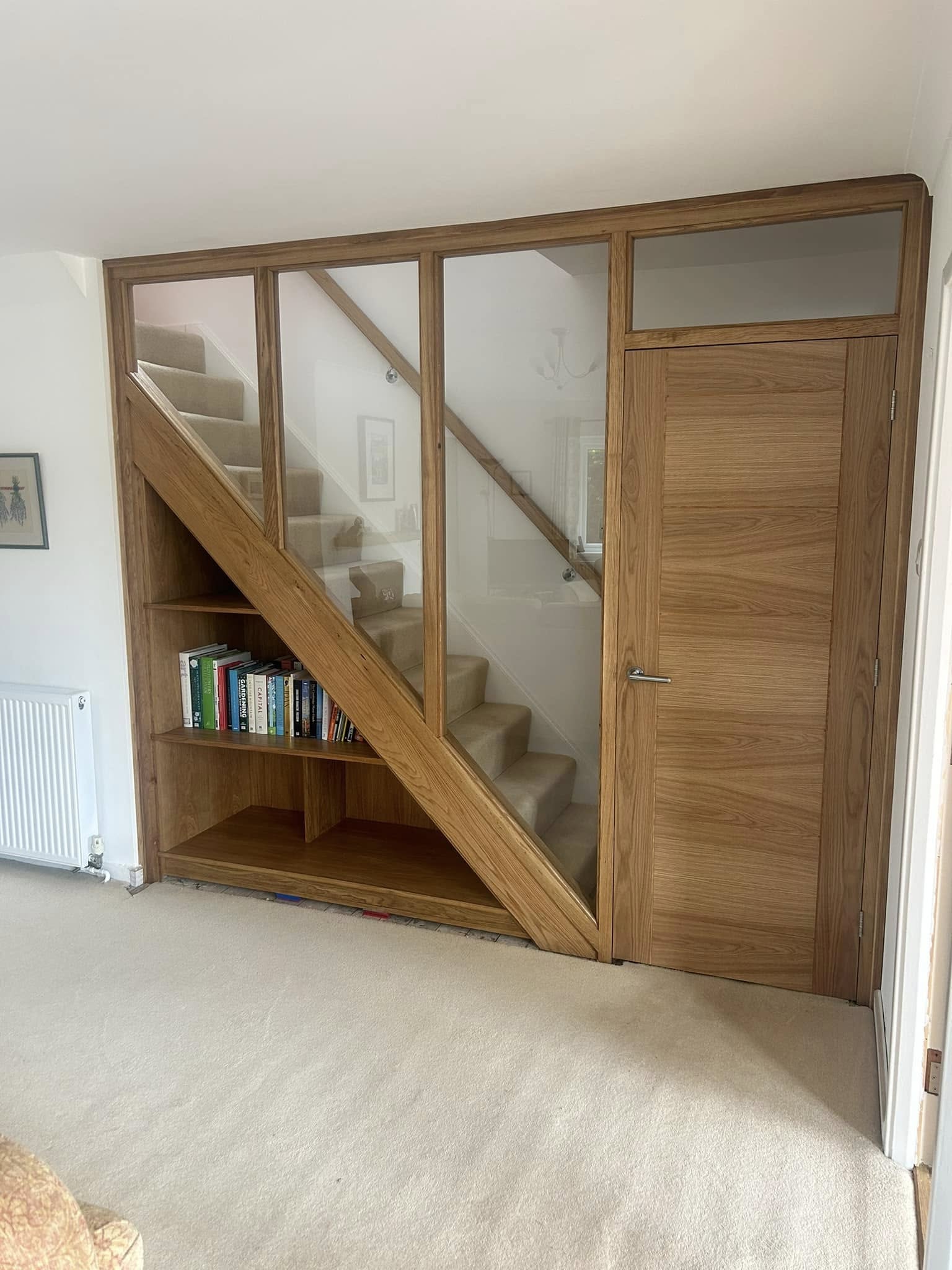 Bespoke staircase and glass wall installation in a modern property