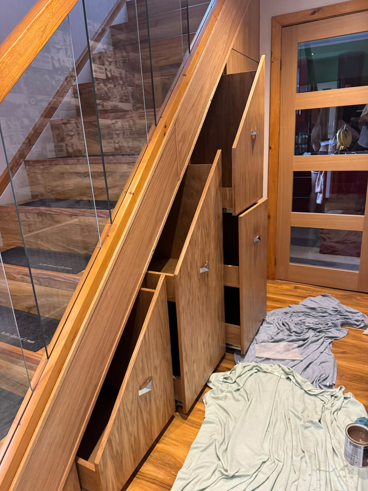 Made-to-measure under-stair storage with fitted oak drawers and cabinet doors